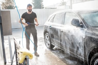 man-washing-car-with-water-gun-2025-03-18-04-59-30-utc (1)